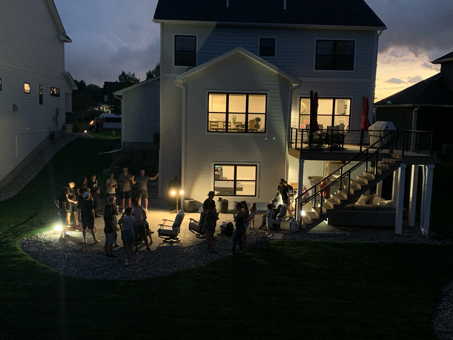 The original Burnside Way Corn Hole Championship gathering on the patio under the lights