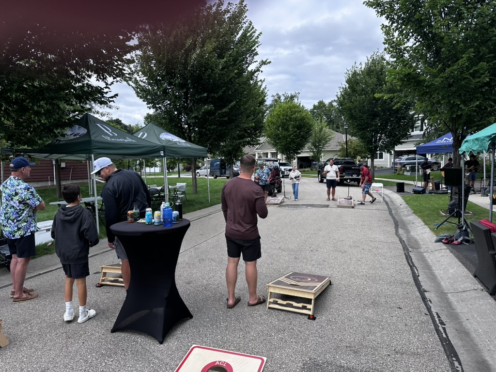 Cornhole games filling the street during Burnside Way Days