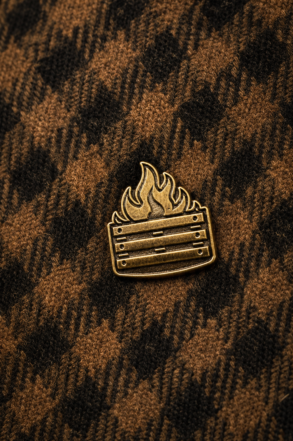 The Antique Bronze Legacy Pin on brown tweed
